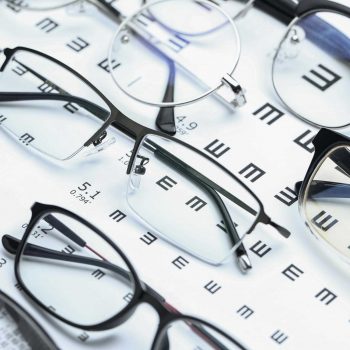 glasses-and-eye-chart-on-white-background