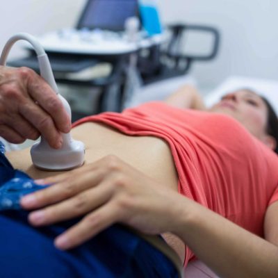 woman-getting-ultrasound-of-abdomen-from-doctor